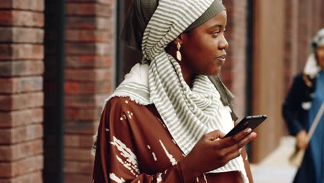 Young-Woman-Using-Smartphone-Outside